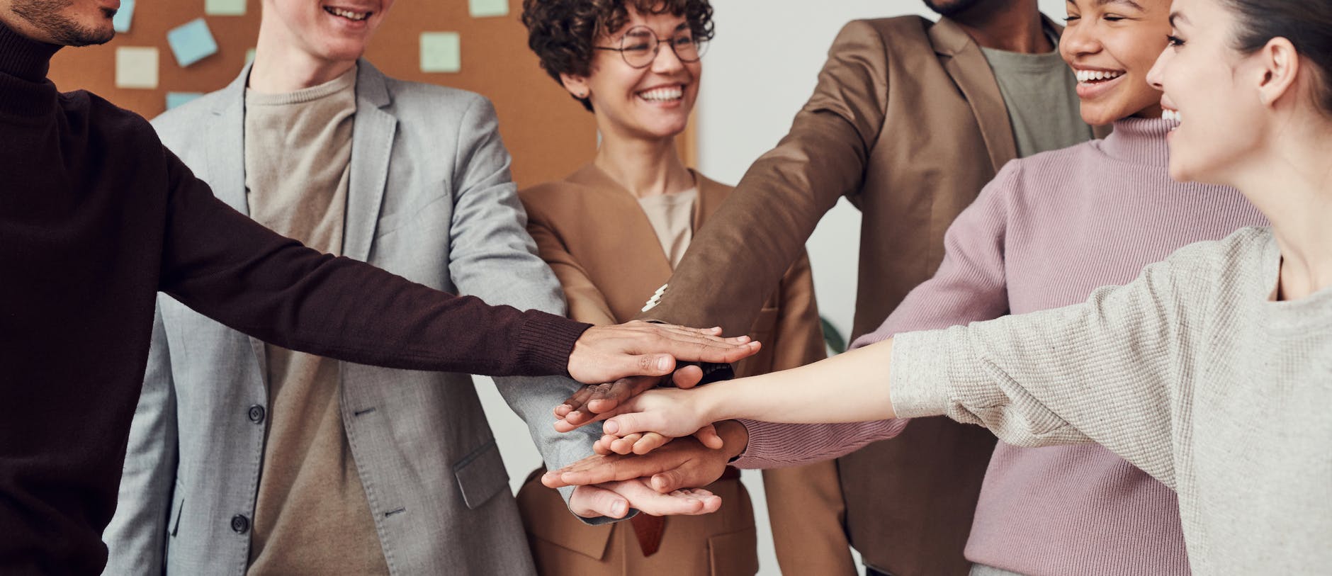 photo of people holding each other s hands