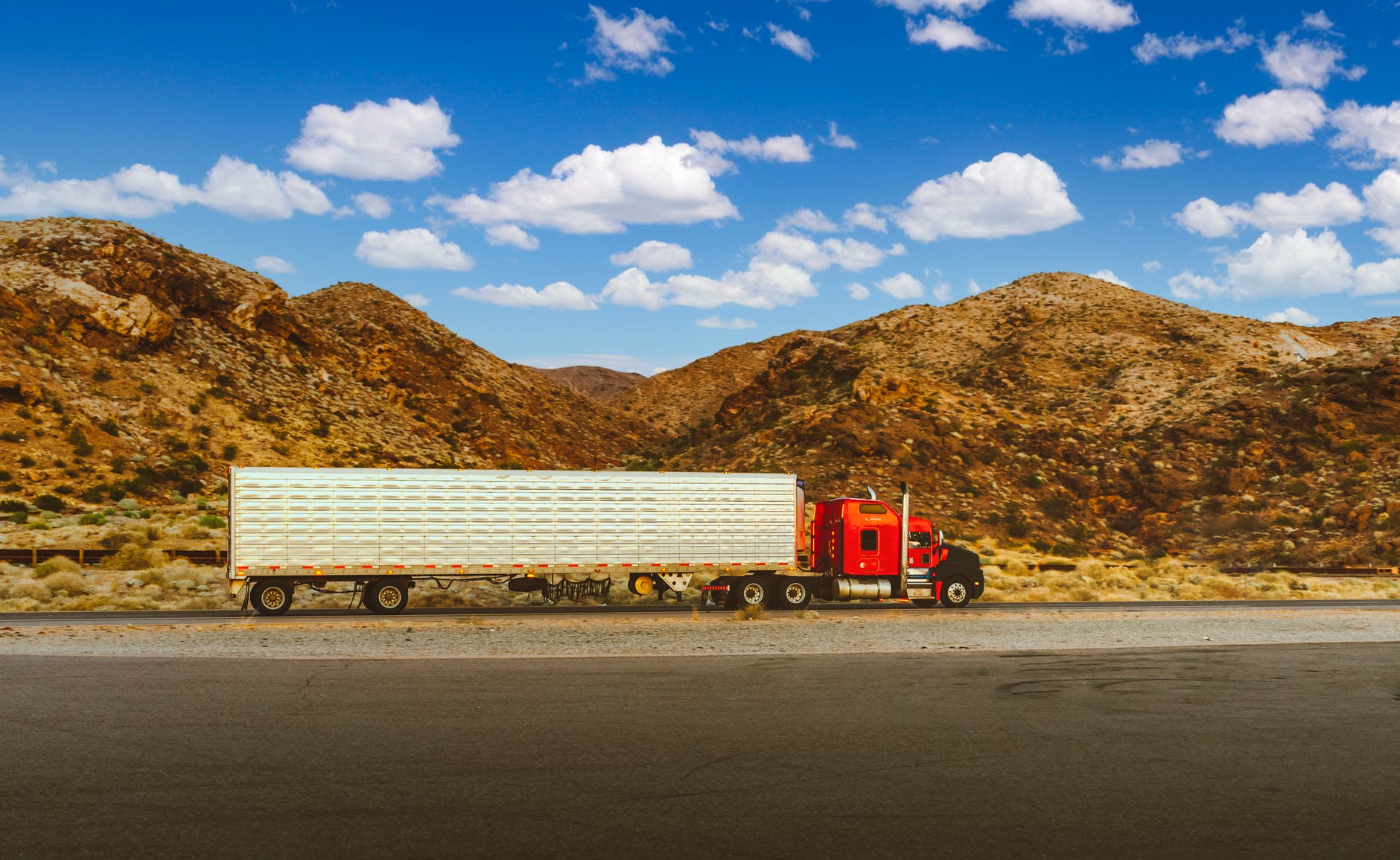 red semi truck on the road